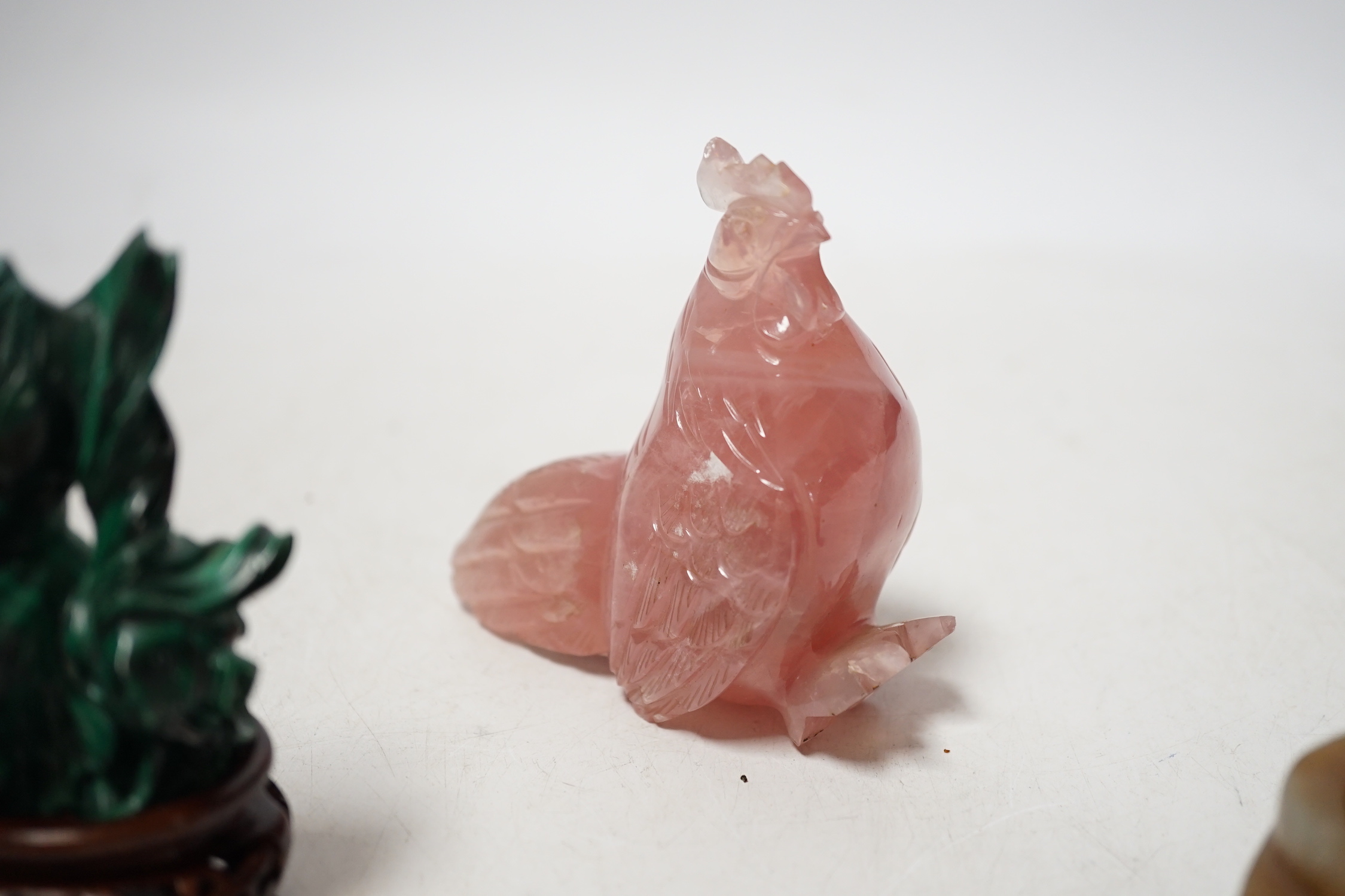 A group of Chinese hardstone carvings and a soapstone cong, largest 10.5cm
